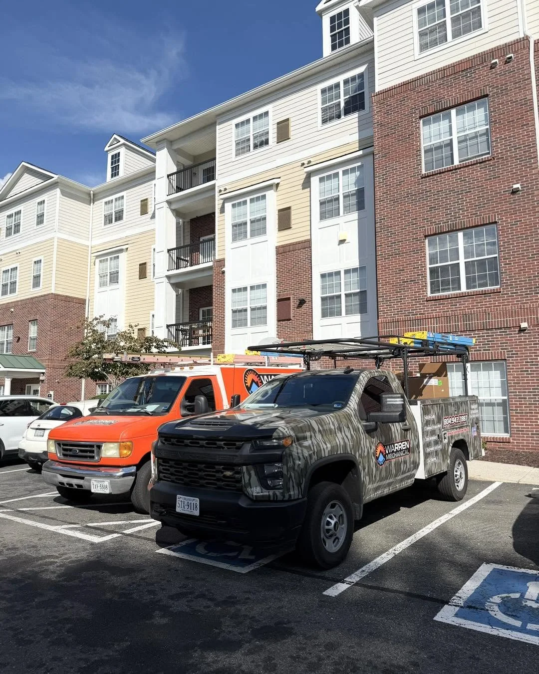 Warren Mechanical's branded service vehicles at an actual company jobsite